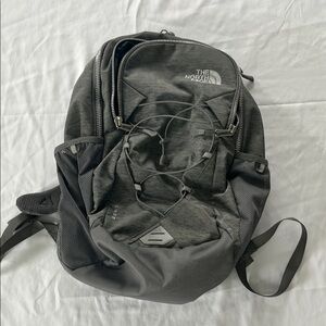The North Face Gray Backpack with Adjustable Straps and Sleek Design